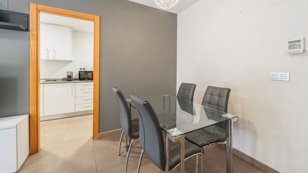 A modern kitchen with white cabinets, a microwave, and a toaster. - Apartment 'Edimar' with Balcony and Air Conditioning (Benidorm)