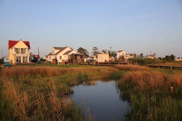 A coastal residential area with houses and a small body of water.