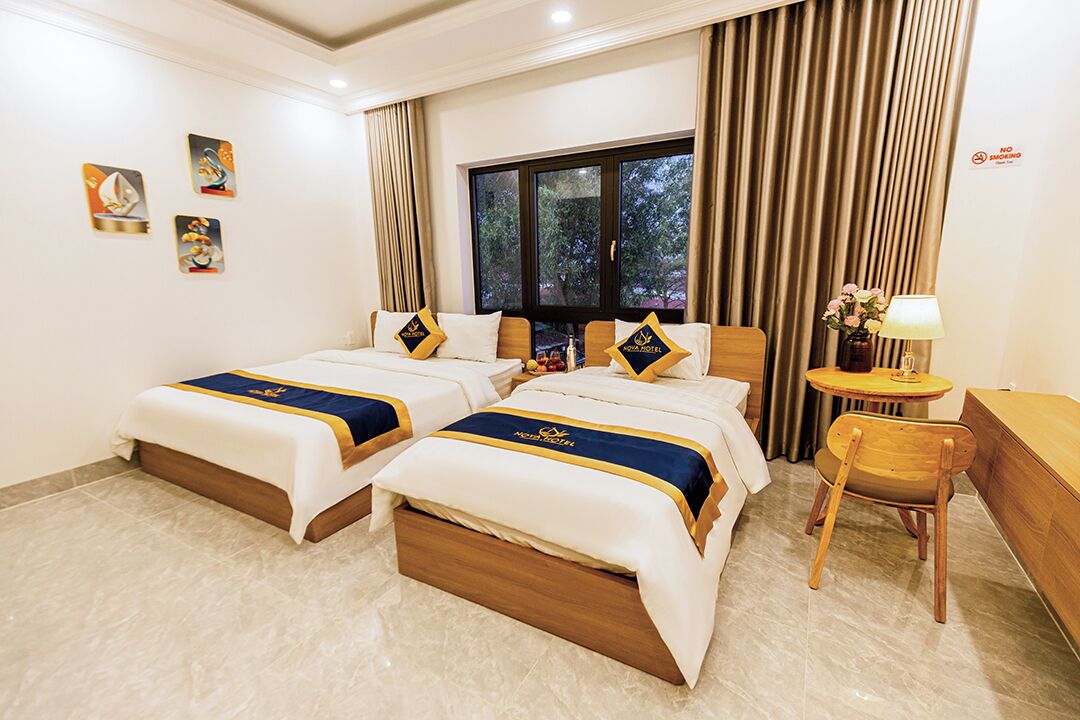 Standard Quadruple Room, Balcony, City View | Premium bedding, minibar (some free items), desk, blackout drapes