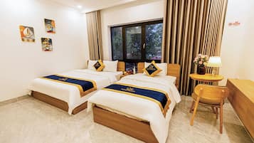 Standard Quadruple Room, Balcony, City View | Premium bedding, minibar (some free items), desk, blackout drapes