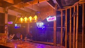 A bar area with a neon sign indicating 'VIP lounge' and 'OPEN' status. - Studio, Sleeps 2 Near Northern Line Edgware St (Edgware)