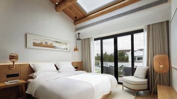 Family Suite, Balcony, Garden View | Desk, laptop workspace, blackout drapes, soundproofing
