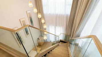 Deluxe Suite, Garden View, Poolside | Premium bedding, desk, laptop workspace, blackout drapes
