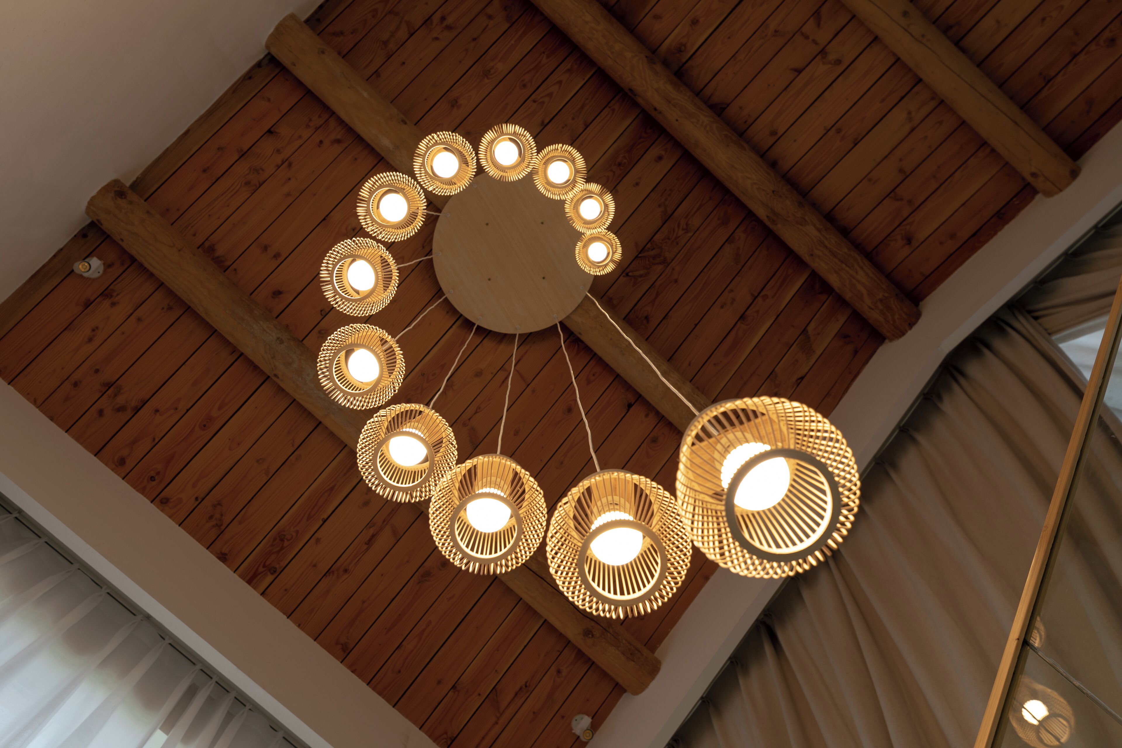 A ceiling with a circular light fixture with multiple bulbs.