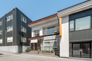 A modern two-story building with a storefront on the ground floor. - HARMONY OTARU (Otaru)