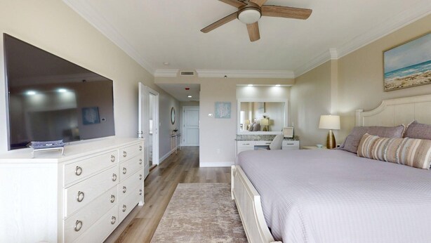 A bedroom with a bed, dresser, vanity, and ceiling fan. - Summit 908/908A Luxury Gulf-View Escape | TOPS'L Resort | Walk to the Beach (Miramar Beach)