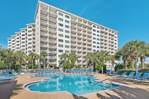 A hotel with multiple floors, a swimming pool, and palm trees. - Summit 908 – Spacious Gulf-View Retreat at TOPS'L (Miramar Beach)