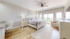 A bedroom with a bed, bedside tables, a desk, a chair, and a balcony with a view. - Summit 0908A Romantic Gulf-View Studio at TOPS'L Resort (Miramar Beach)
