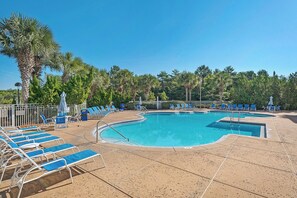 A swimming pool with blue lounge chairs and umbrellas, surrounded by palm trees and a clear sky. - Summit 0908A Romantic Gulf-View Studio at TOPS'L Resort (Miramar Beach)