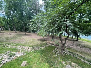 A natural landscape with trees and a body of water in the background. - Lakeside Walk-In from House - Luxury Lake Cabin - Big Views - Pool Table (Shell Knob)