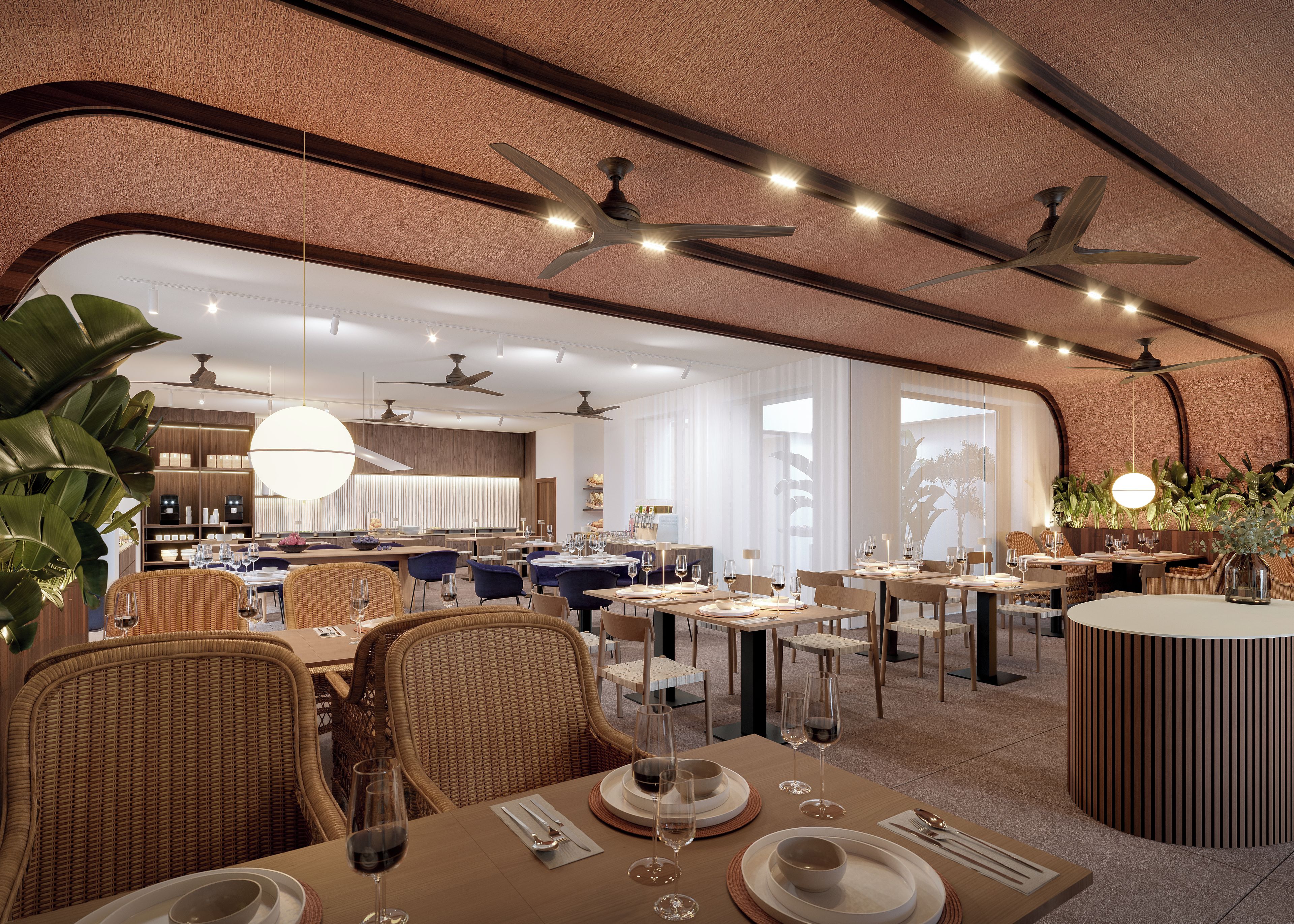 Un restaurante con varias mesas, ventiladores de techo y grandes ventanales.