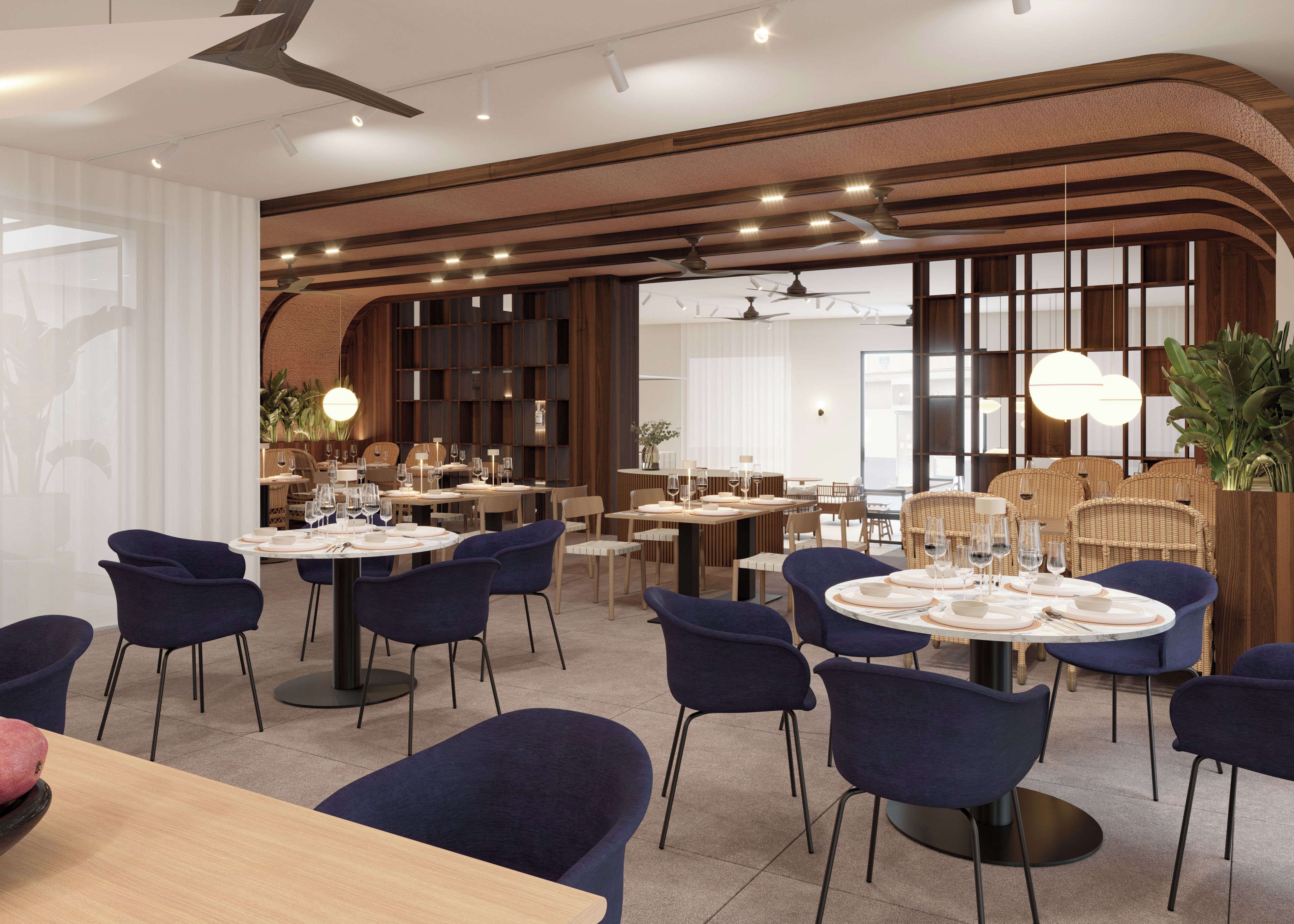 Un comedor moderno con mesas redondas, sillas azules y detalles de madera.