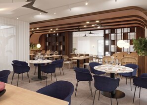 A modern dining area with round tables, blue chairs, and wooden accents. - Hotel Zenit San Telmo (Málaga)