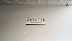 A wall with the text 'CASATEL' and 'EUROPEAN BOUTIQUE HOTEL' indicating the name of the establishment. - Casatel Jeonju Hanok Village (Jeonju)