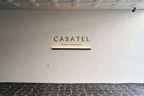 A wall with the text 'CASATEL' and 'EUROPEAN BOUTIQUE HOTEL' indicating the name of the establishment.