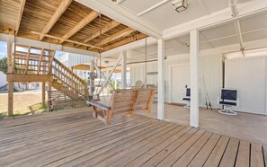 A wooden deck with a swing, a staircase, and a sign reading 'BEACH HOUSE'. - Lagoon Access, Short Walk to the beach, Sleeps 10! (Gulf Shores)