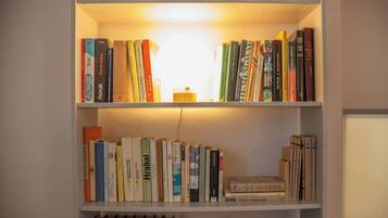 A bookshelf with multiple shelves filled with books.