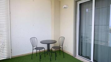 Triple Room, Balcony, Sea View | Outdoor dining