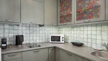 Superior Villa, Sea View | Private kitchen | Espresso maker, coffee/tea maker, full-size fridge, microwave