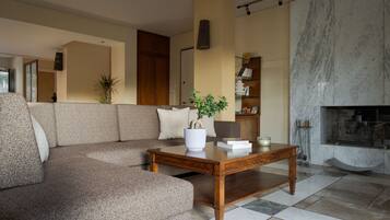 Superior Villa, Sea View | Living area | 55-inch Smart TV with cable channels