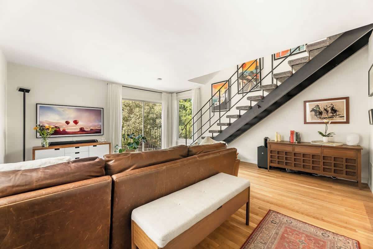 Mid-century modern living room with comfortable seating and natural lighting in Hollywood Hills.
