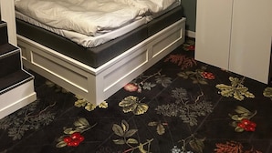A bunk bed with a lower bunk, a white wardrobe, and a framed picture on the wall. - The Malt House Inn (Gothenburg)