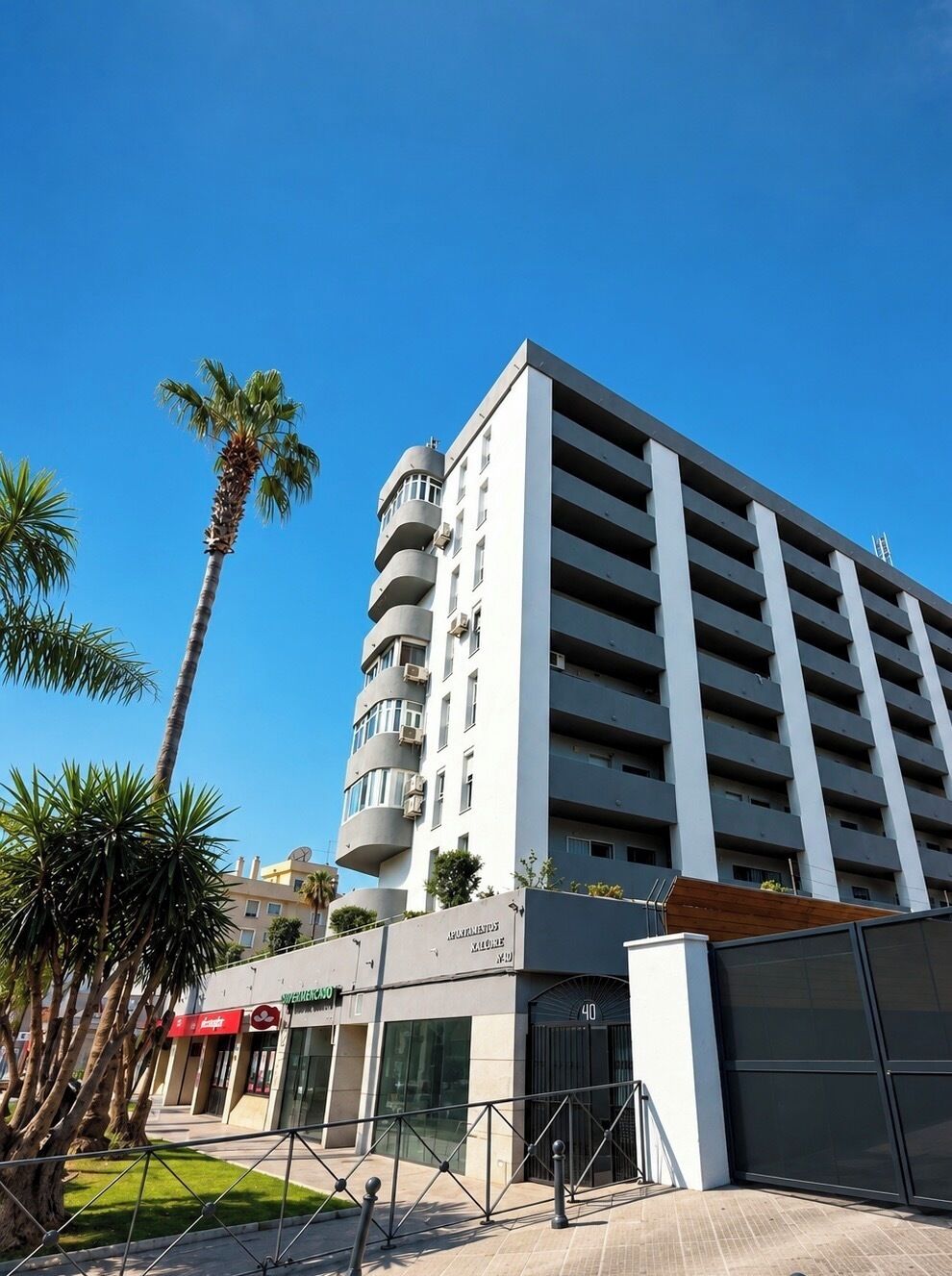 A multi-story hotel with a modern design, featuring a prominent entrance and a visible parking garage.