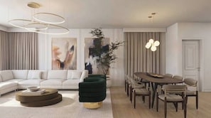 A modern living room with a sectional sofa, a round coffee table, a dining table with chairs, and a large plant. - 7BR house at Windsor Cay Resort (Clermont)