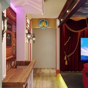 Enter a lively entertainment area adorned with rich red drapery and warm wooden accents. The vintage-inspired decor and soft lighting create a welcoming atmosphere perfect for relaxation and enjoyment. - 7BR house at Windsor Cay Resort (Clermont)