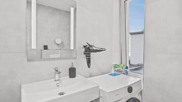Shower, hair dryer, towels, soap