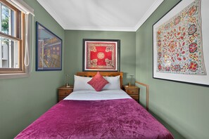 A room with a bed, two bedside tables, a window, and two framed artworks on the walls. - Kingsley Discover Cafs Street Art and Village Life (Newtown)