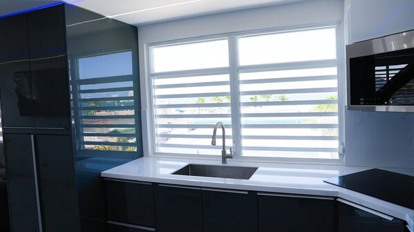 Fridge, microwave, cookware/dishes/utensils