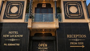 A hotel facade with a sign reading 'HOTEL NEW LUCKNOW' and a reception area marked 'OPEN WELCOME FROM SIDE'. - Hotel New Lucknow (Lucknow)