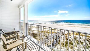 A balcony with a view of a beach and ocean. - Beachfront Bliss Beach House (Orange Beach)