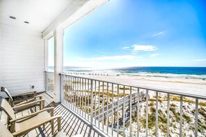 A balcony with a view of a beach and ocean. - Beachfront Bliss Beach House (Orange Beach)