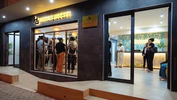 A hostel with a reception desk and a sign indicating it is a hostel.