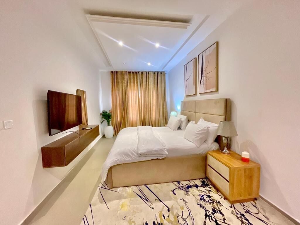 Deluxe Apartment, Balcony, City View | In-room safe, desk, laptop workspace, blackout drapes