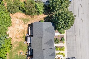 A residential property with a large house, a garage, and a driveway.