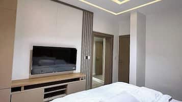 Deluxe Apartment, Balcony, City View | Desk, laptop workspace, blackout drapes, soundproofing
