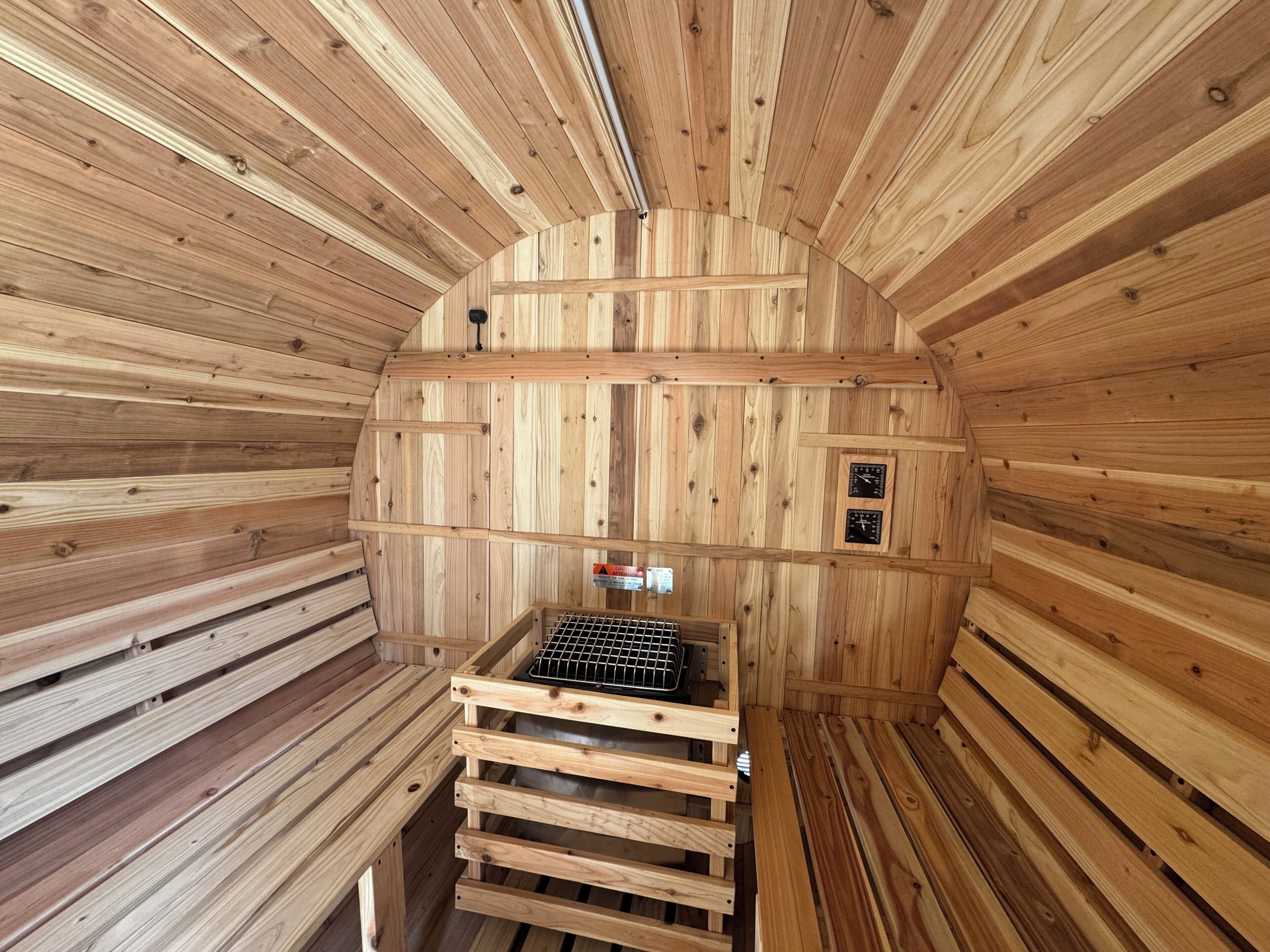A sauna with wooden walls and a bench.