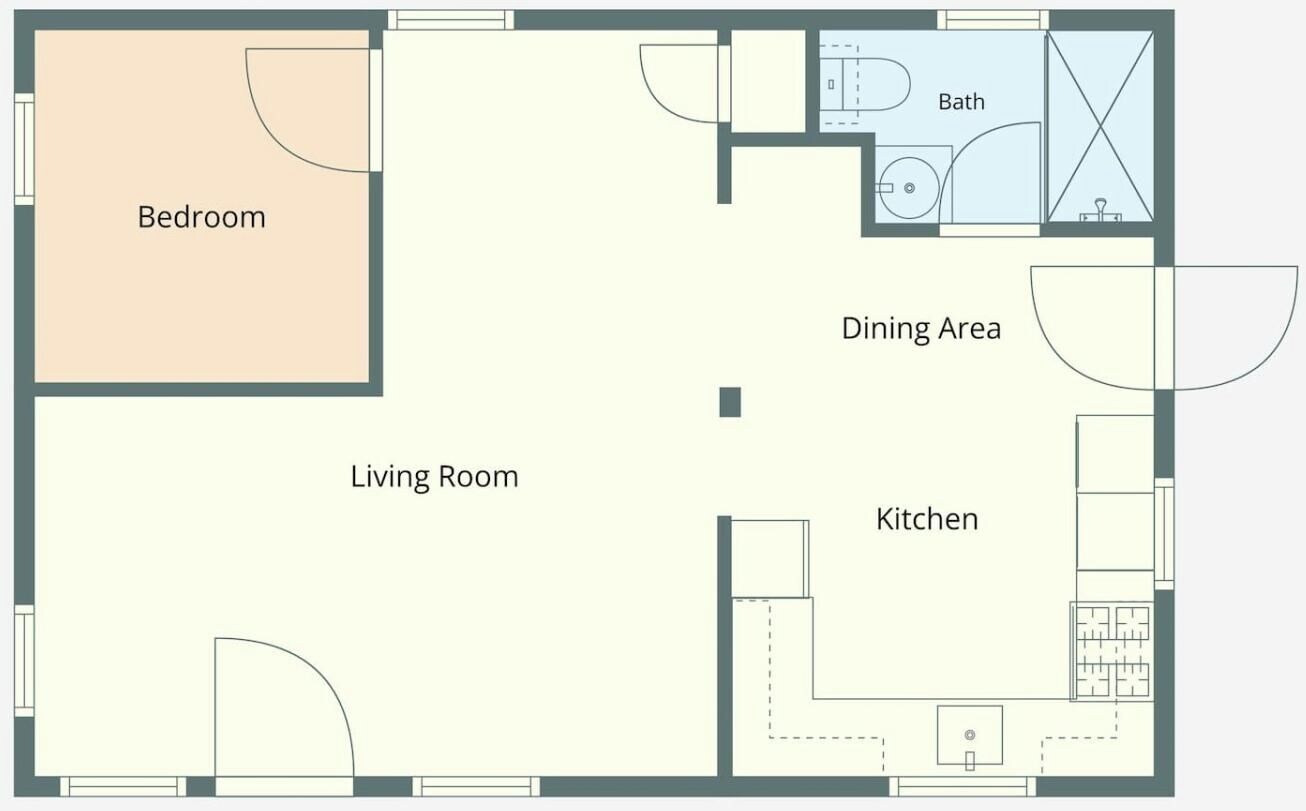 Ein Grundriss mit Schlafzimmer, Wohnzimmer, Essbereich, Küche und Bad.