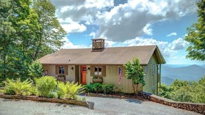 A single-story house with a chimney, a front porch, and a flag. - Blissful Vista has breathtaking gorge views, seclu (Blowing Rock)