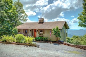 A single-story house with a chimney, a front porch, and a flag. - Blissful Vista has breathtaking gorge views, seclu (Blowing Rock)