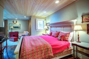 A bedroom with a large bed, a television, a dresser, and a window. - The Hill is the best in country living, minutes fr (Blowing Rock)