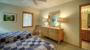 A bedroom with two beds, a dresser, a mirror, and a ceiling fan. - Fair Haven - Great App Ski Mtn Location! (Blowing Rock)