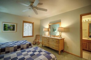 A bedroom with two beds, a dresser, a mirror, and a ceiling fan. - Fair Haven - Great App Ski Mtn Location! (Blowing Rock)