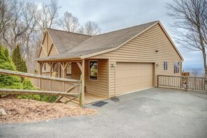 A single-story building with a gabled roof, a covered porch, and a garage. - Fair Haven - Great App Ski Mtn Location! (Blowing Rock)