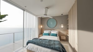 A modern bedroom with a large bed, a ceiling fan, and a view of the ocean. - Praia Suites by Avia Suites (Santa Marta)