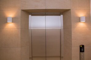 An elevator with a digital display and a control panel on the right side. - Urban Studio+BigComfy Bed+EmbsyGdns, Cantonments (Accra)