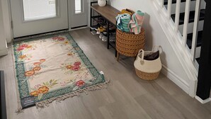 A hallway with a wooden bench, a potted plant, a woven basket, and a staircase with black railings. - Gorgeous 4 Bedroom & 3 Bathroom Townhome Cottage - Blue Mountain (The Blue Mountains)